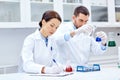 Young scientists making test or research in lab Royalty Free Stock Photo