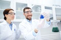 Young scientists making test or research in lab Royalty Free Stock Photo