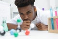 Young scientists studying dna models Royalty Free Stock Photo