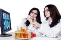 Young scientists working with chemical liquid Royalty Free Stock Photo
