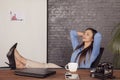 A young secretary enjoys a free moment, rest at work Royalty Free Stock Photo