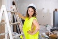 Young seductive woman builder in apartment during repair works Royalty Free Stock Photo