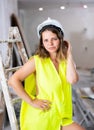 Young seductive woman builder in apartment during repair works Royalty Free Stock Photo