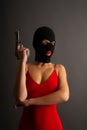 Girl gun balaclava red Royalty Free Stock Photo