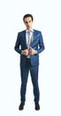 Young self-confident man in suit and grey tie on white wall background Royalty Free Stock Photo