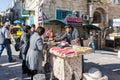 A young seller sells sweets to customers in the main square - Manger Square - in Bethlehem in Palestine