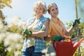 Young and senior woman posing for photo in their garden