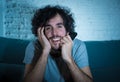 Close up portrait of funny young man hocked watching romantic movie TV