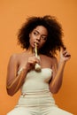 Young sensual african american woman with artistic make-up drinking milk from bottle Royalty Free Stock Photo