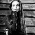 Young sensual & beauty brunette woman pose on wooden background. Black-white photo Royalty Free Stock Photo