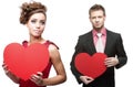 Young sensual woman and handsome man holding red heart on white Royalty Free Stock Photo