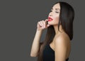 Young sensual woman with red lipstick and straight hair. Eyes closed. dark background Royalty Free Stock Photo