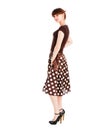 Young sensuality beautiful girl in spotted skirt