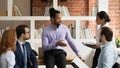 Young serious african american boss leading brainstorming meeting. Royalty Free Stock Photo