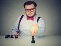 Serious business man playing chess game Royalty Free Stock Photo