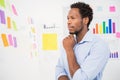 Young serious businessman looking at sticky notes Royalty Free Stock Photo