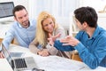 Young serious couple meeting a real estate agent Royalty Free Stock Photo