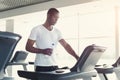 Young man in gym run on treadmill Royalty Free Stock Photo