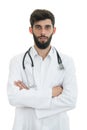 Young serious handsome bearded doctor with white coat and stethoscope. Royalty Free Stock Photo