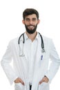 Young serious handsome bearded doctor with white coat and stethoscope. Royalty Free Stock Photo