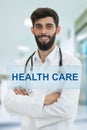 Young serious handsome bearded doctor with white coat and stethoscope. Royalty Free Stock Photo