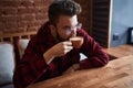 Young serious handsome man drinking coffee Royalty Free Stock Photo