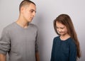 Young serious teen father have a dialog with his small school girl daughter. Happy joyful emotions on toned vintage color