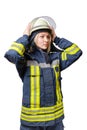 Young serious women firefighter puts a helmet on his head