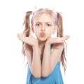 Young seven years old brunette girl in blue dress on a white iso