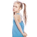 Young seven years old brunette girl in blue dress on a white iso