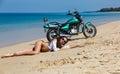 Young, sexual, the girl on the motorcycle, on a beach Royalty Free Stock Photo