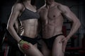 Young athletic man and woman after fitness exercise. Perfect muscular body Royalty Free Stock Photo