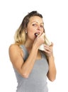 Young and attractive blond girl with spoon eating natural cream yogurt in diet healthy nutrition Royalty Free Stock Photo