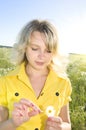 Young blonde on background with daisywheel