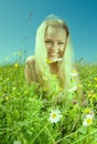 Young  Sexy  blonde   on  meadow with camomile Royalty Free Stock Photo