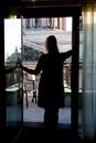 Young blonde woman staying at balcony silhouette Royalty Free Stock Photo