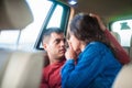 Young sexy couple on the back seat of car Royalty Free Stock Photo