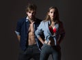 Young sexy couple of pretty girl or beautiful woman in red sexy bra and handsome man muscular macho in unbutton shirts Royalty Free Stock Photo