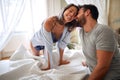 Young sexy couple in underwear having a foreplay in bed in the morinig on valentines day. Intimacy, passion, erotic concept Royalty Free Stock Photo