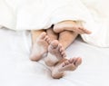 Young couples in bed Royalty Free Stock Photo