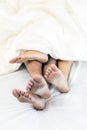 Young couples in bed Royalty Free Stock Photo