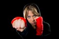 Young dangerous girl shadow boxing with wrapped hands and wrists training workout Royalty Free Stock Photo