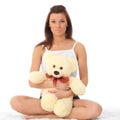 Girl in lingerie with a teddy bear