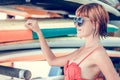 Young girl in red swimsuit - surfer with surf board posing on the Nusa Dua beach, tropical Bali island, Indonesia Royalty Free Stock Photo