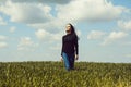 Pretty girl on green grass and sky Royalty Free Stock Photo