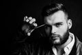 Young sexy man, portrait of guy with barber scissors for barber shop. Modern barbershop, shaving. Handsome male with Royalty Free Stock Photo