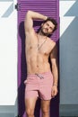 Young sexy man topless outdoor portrait, man dressed in pink shorts Royalty Free Stock Photo