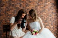 Young photographer shows the bride had just taken photos