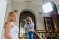 Young photographer is taking pictures the bride Royalty Free Stock Photo