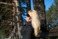 Young russian girl in a park with long blond hair